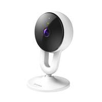White security camera with black lens on a white background